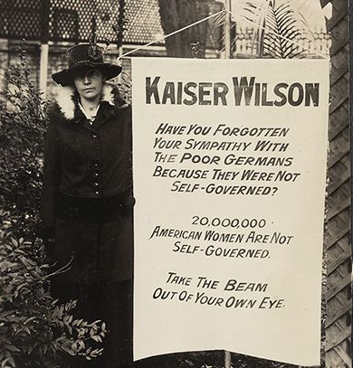 Suffragist Virginia Arnold holding Kaiser Wilson banner, August 1917. Library of Congress.